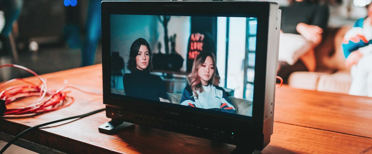 A small group reviewing a camera feed together